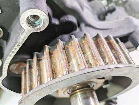 Close-up of a used motorcycle engine timing gear with visible rust, available at Mototech271