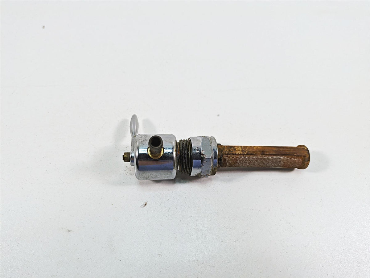 Used motorcycle fuel petcock valve with metal filter on white background, available at Mototech271