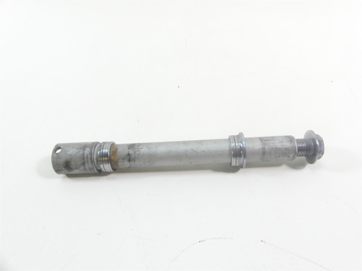 Used motorcycle front axle part on white background, available at Mototech271