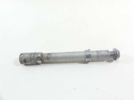 Used motorcycle front axle part on white background, available at Mototech271