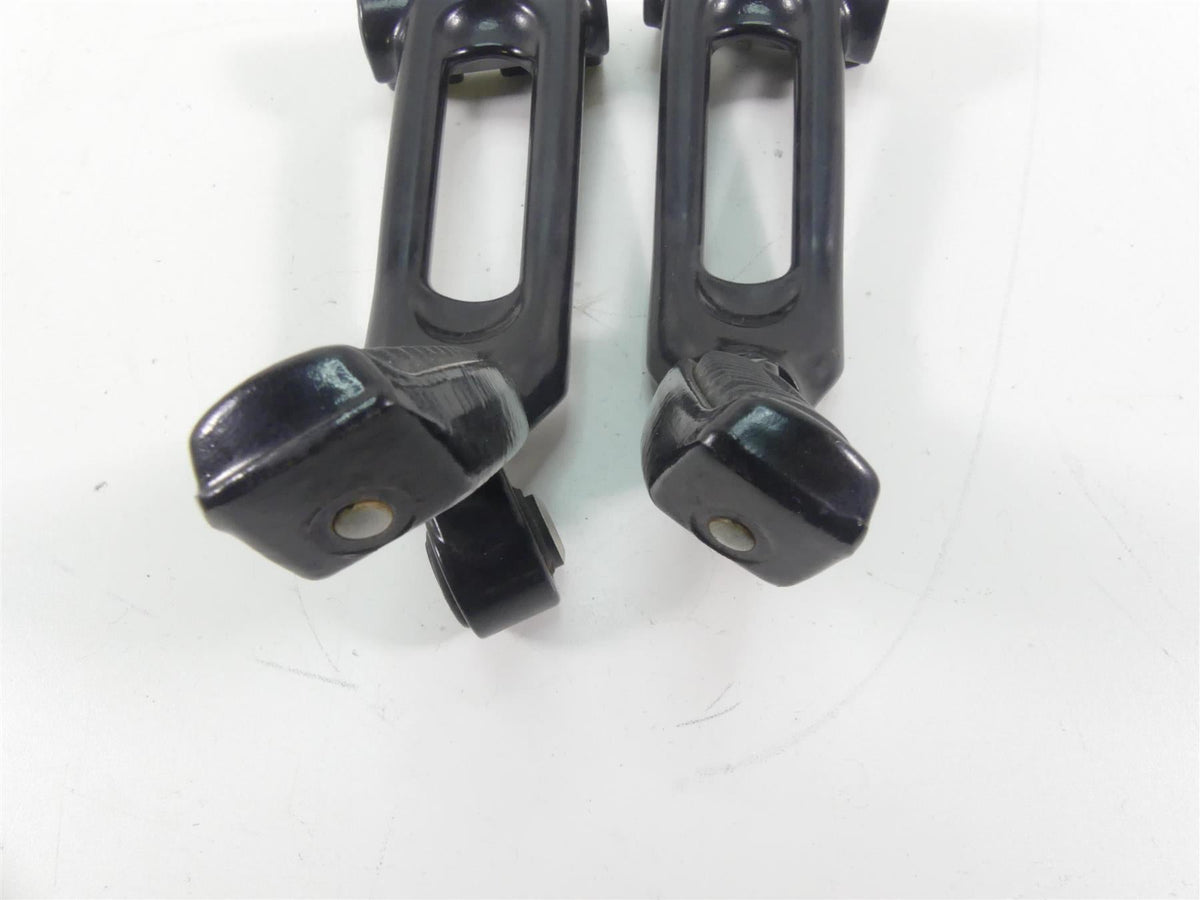 Used black motorcycle foot pegs on white background, available at Mototech271