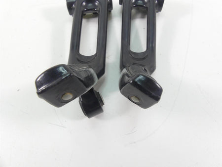 Used black motorcycle foot pegs on white background, available at Mototech271