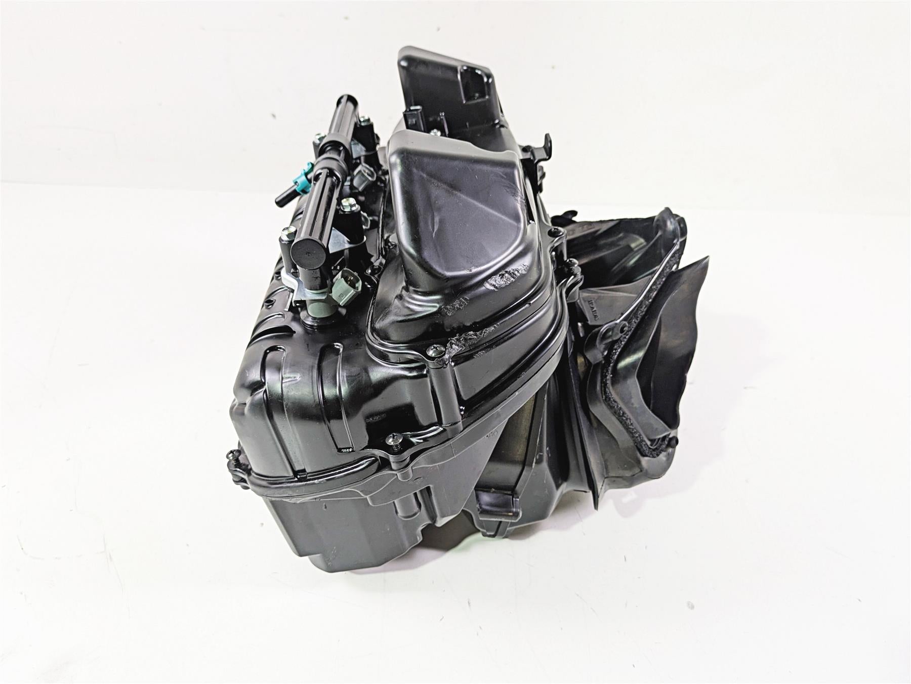 Black plastic motorcycle air intake box with fittings, available at Mototech271