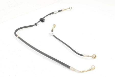 Used motorcycle brake lines with metal banjo fittings on white background, available at Mototech271