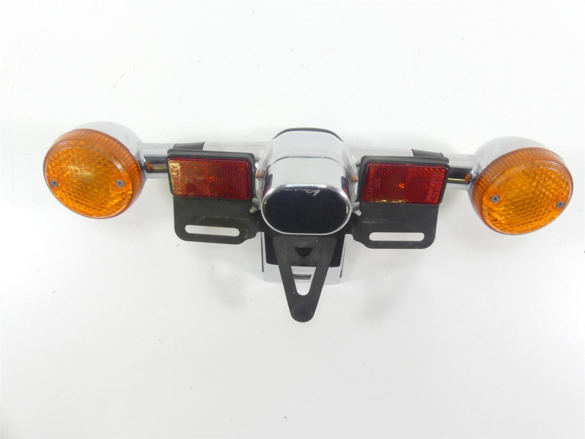 Used motorcycle rear taillight assembly with orange indicators and red reflectors, available at Mototech271