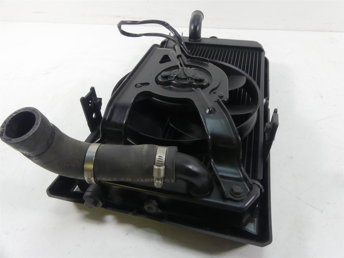 Used motorcycle radiator with cooling fan and hoses, black, available at Mototech271