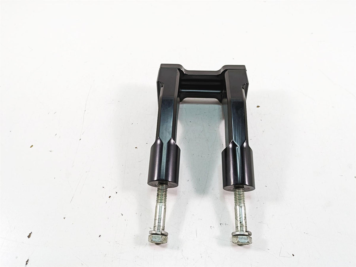 Black motorcycle fork clamp with bolts on white background, available at Mototech271