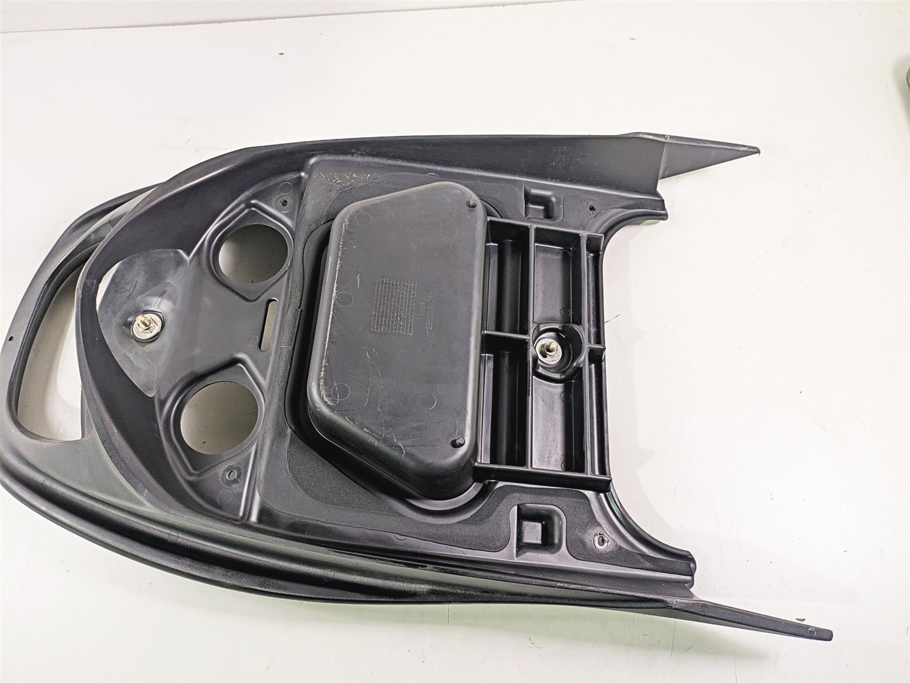 Used black motorcycle seat base plastic with mounting points, available at Mototech271