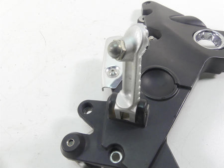 Used motorcycle rearset footpeg and mounting plate, available at Mototech271