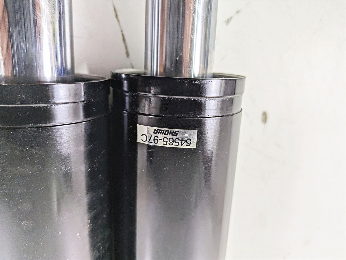 Pair of black Showa motorcycle fork tubes with part number tag available at Mototech271