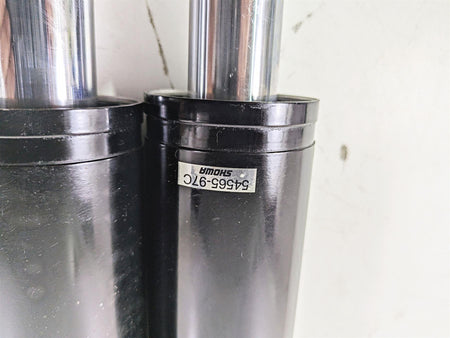 Pair of black Showa motorcycle fork tubes with part number tag available at Mototech271