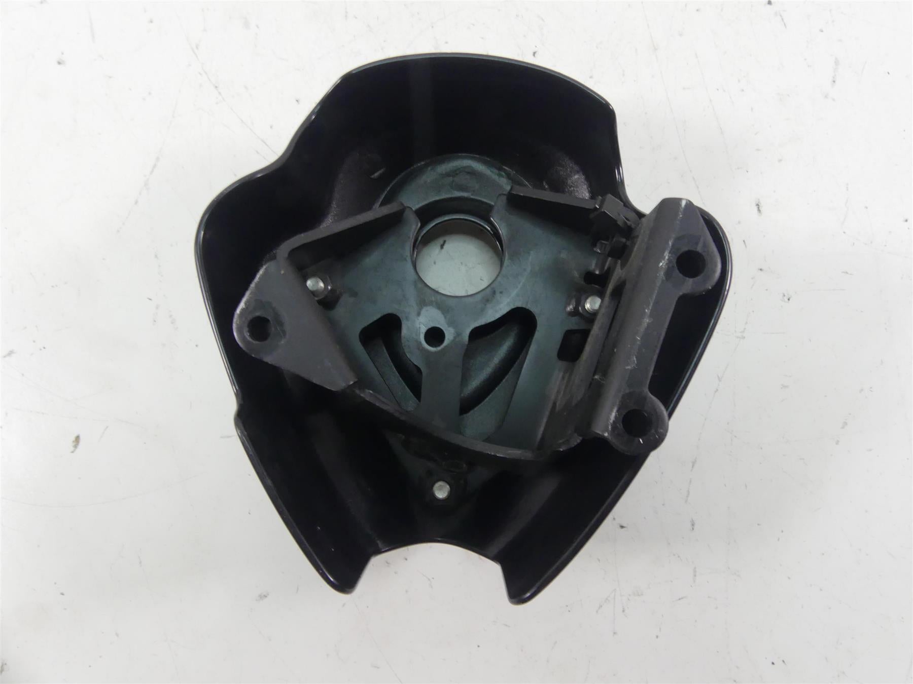 Used black motorcycle headlight housing with mounting bracket, available at Mototech271