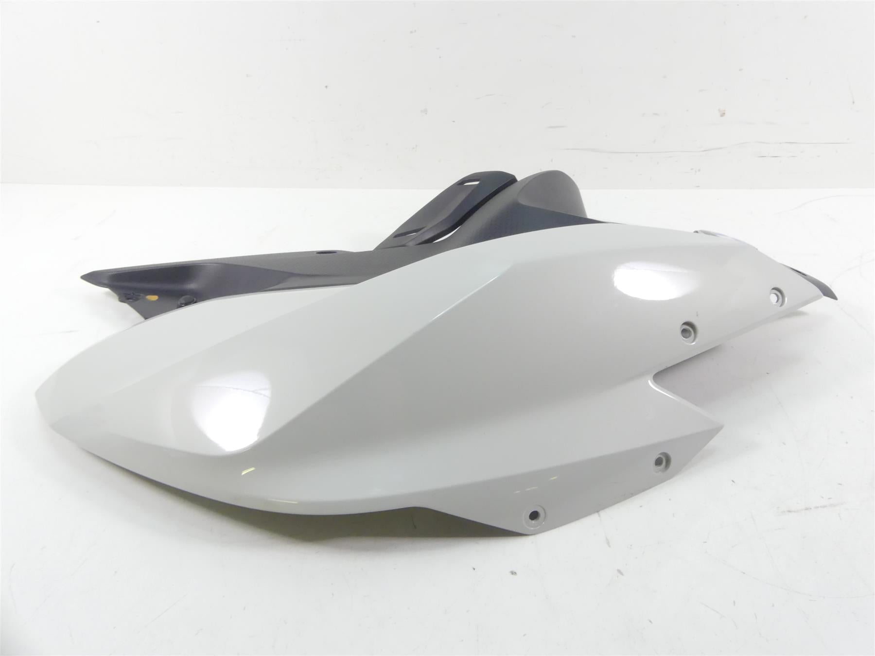 used white and black motorcycle rear fairing part on white background, available at Mototech271
