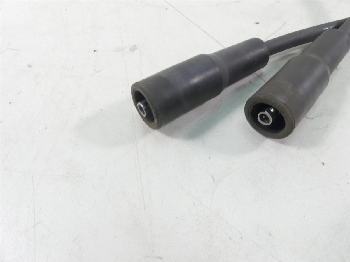 Used motorcycle spark plug wires with connectors on white background, available at Mototech271