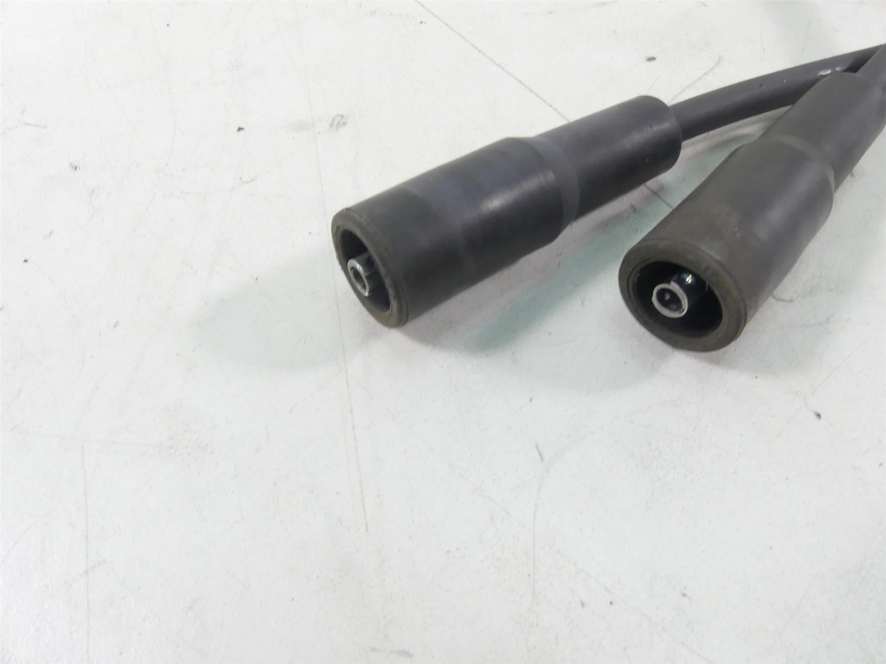 Used motorcycle spark plug wires with connectors on white background, available at Mototech271