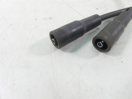 Used motorcycle spark plug wires with connectors on white background, available at Mototech271