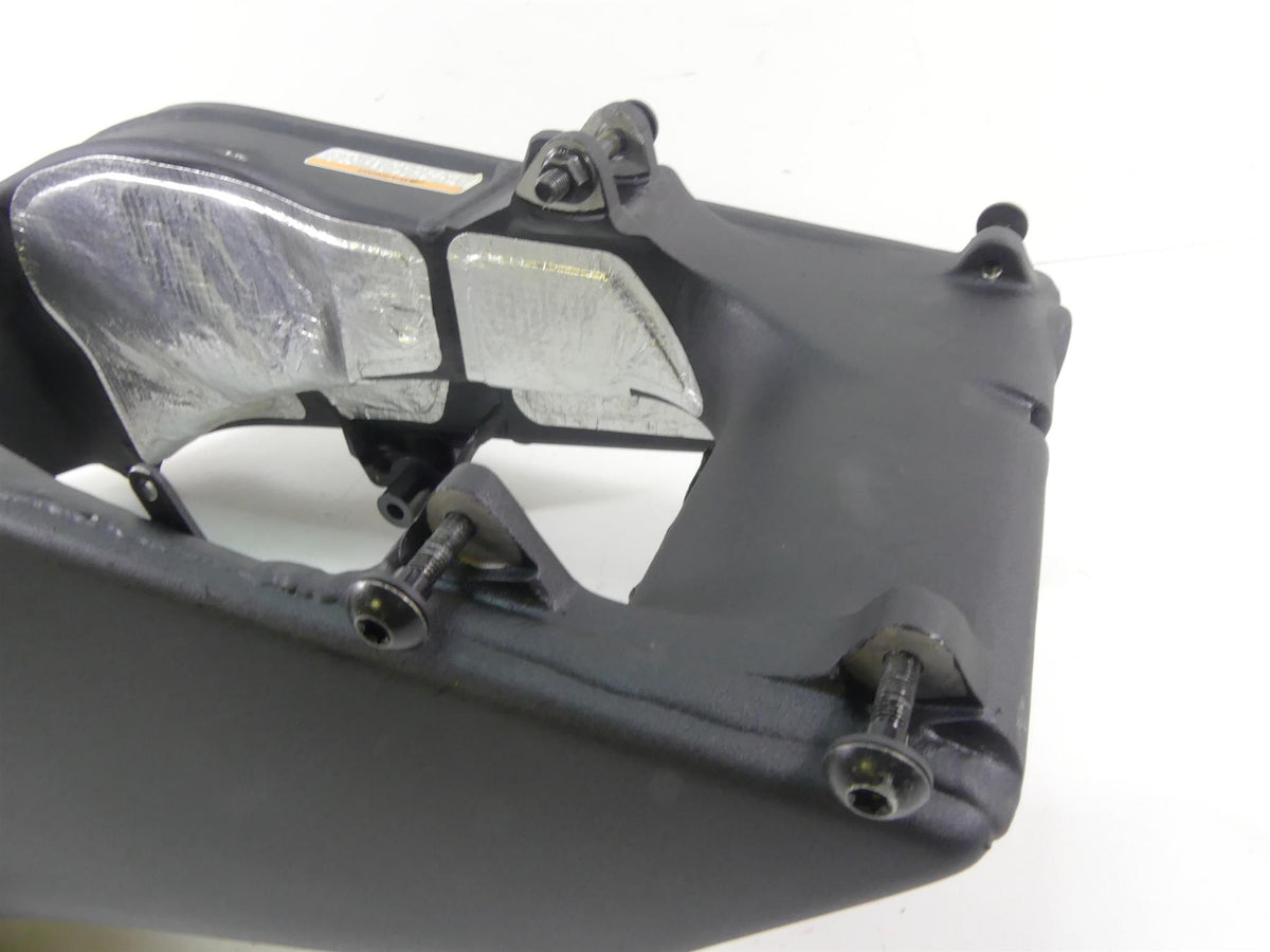 Used motorcycle swingarm part with bolts and heat shield, available at Mototech271