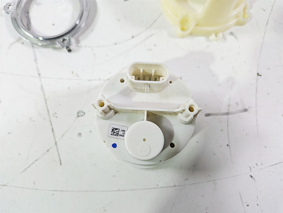 Used white motorcycle sensor part with connector on white surface, available at Mototech271