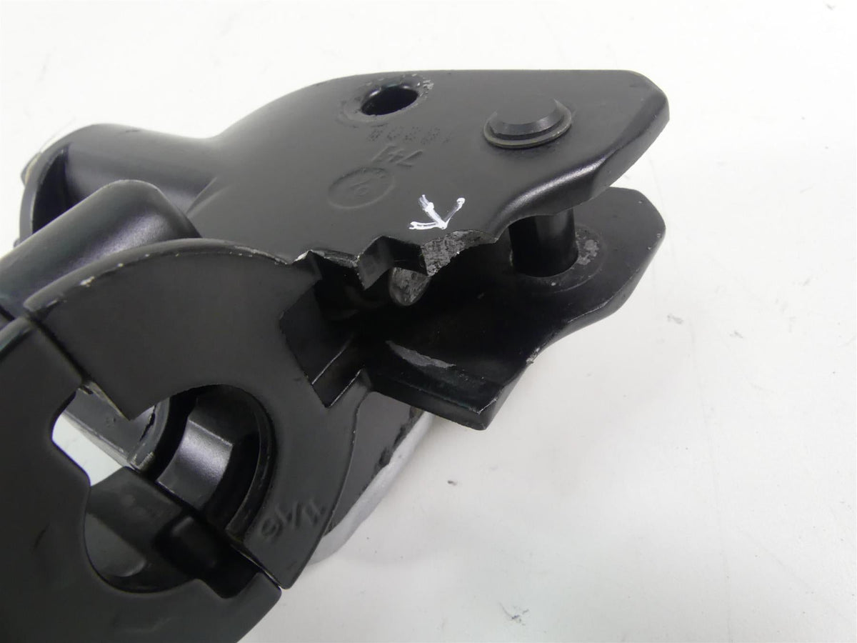 Used black motorcycle mounting bracket with visible damage, available at Mototech271