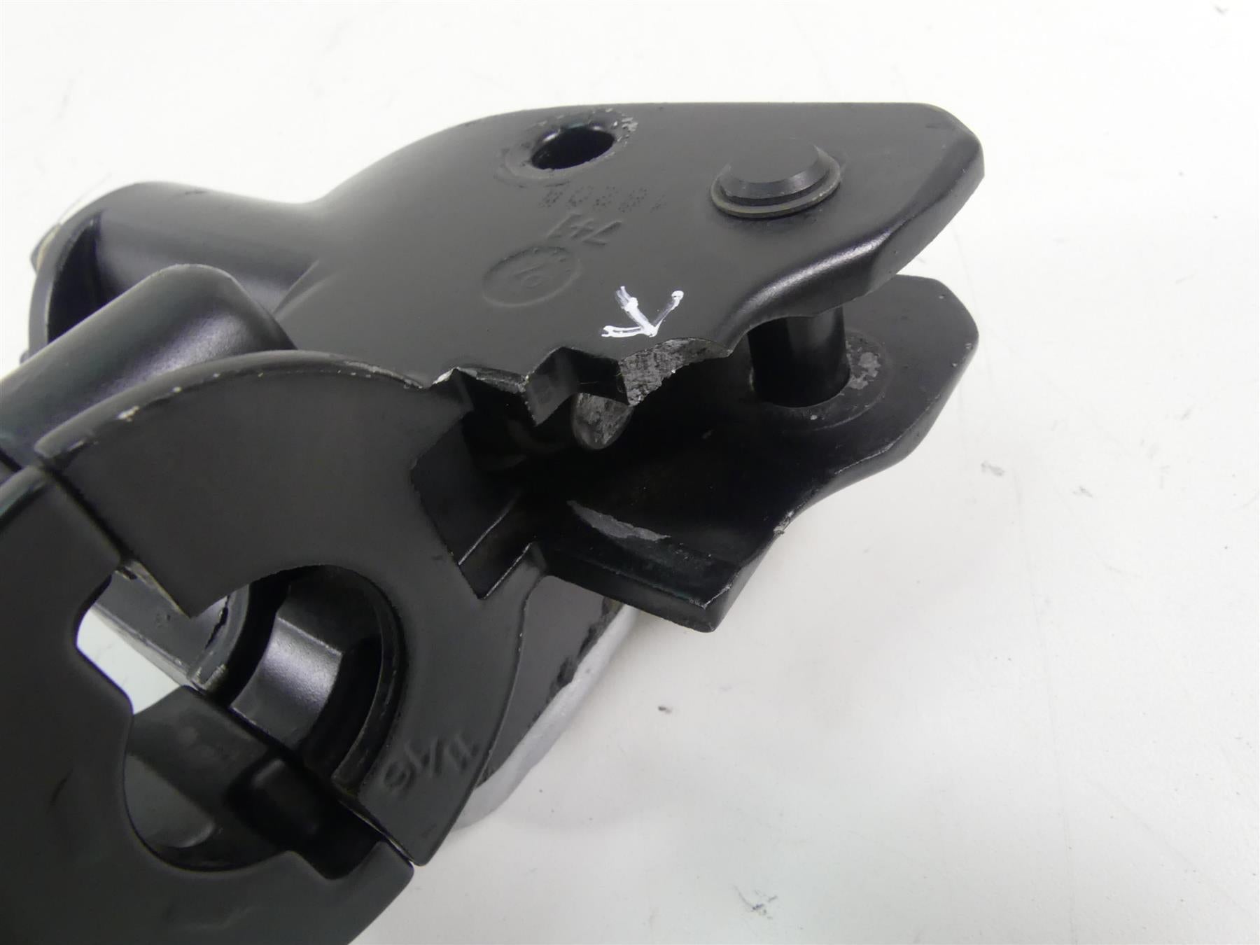 Used black motorcycle mounting bracket with visible damage, available at Mototech271
