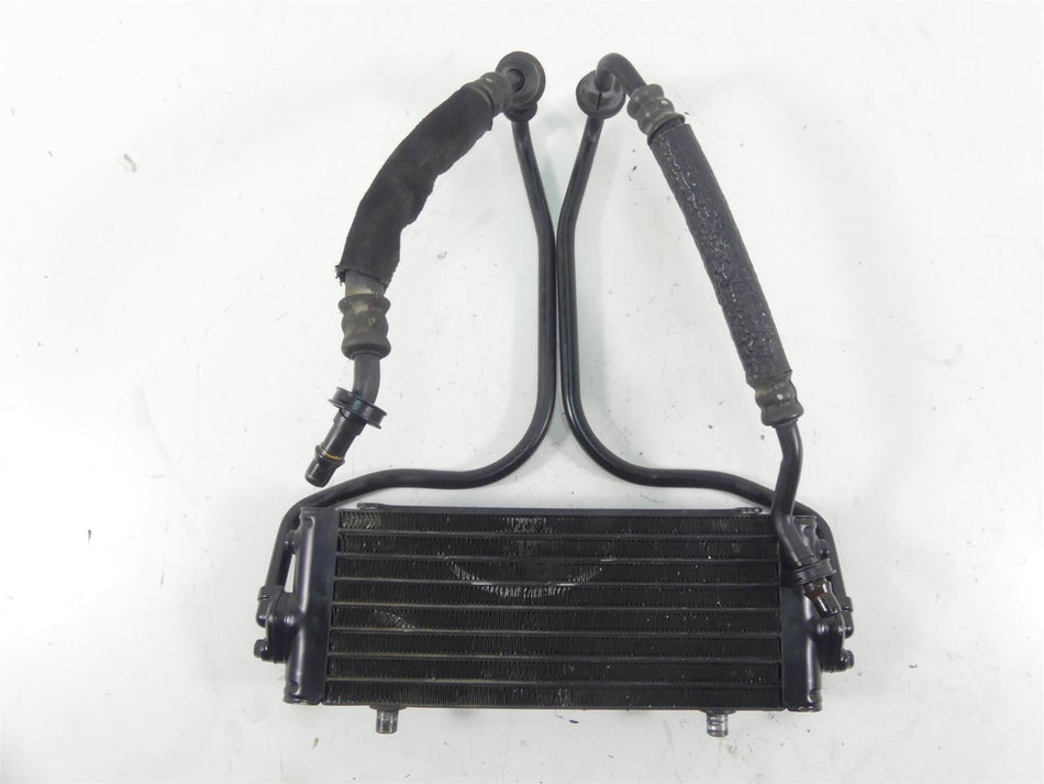 Used motorcycle oil cooler with attached hoses, black metal, available at Mototech271
