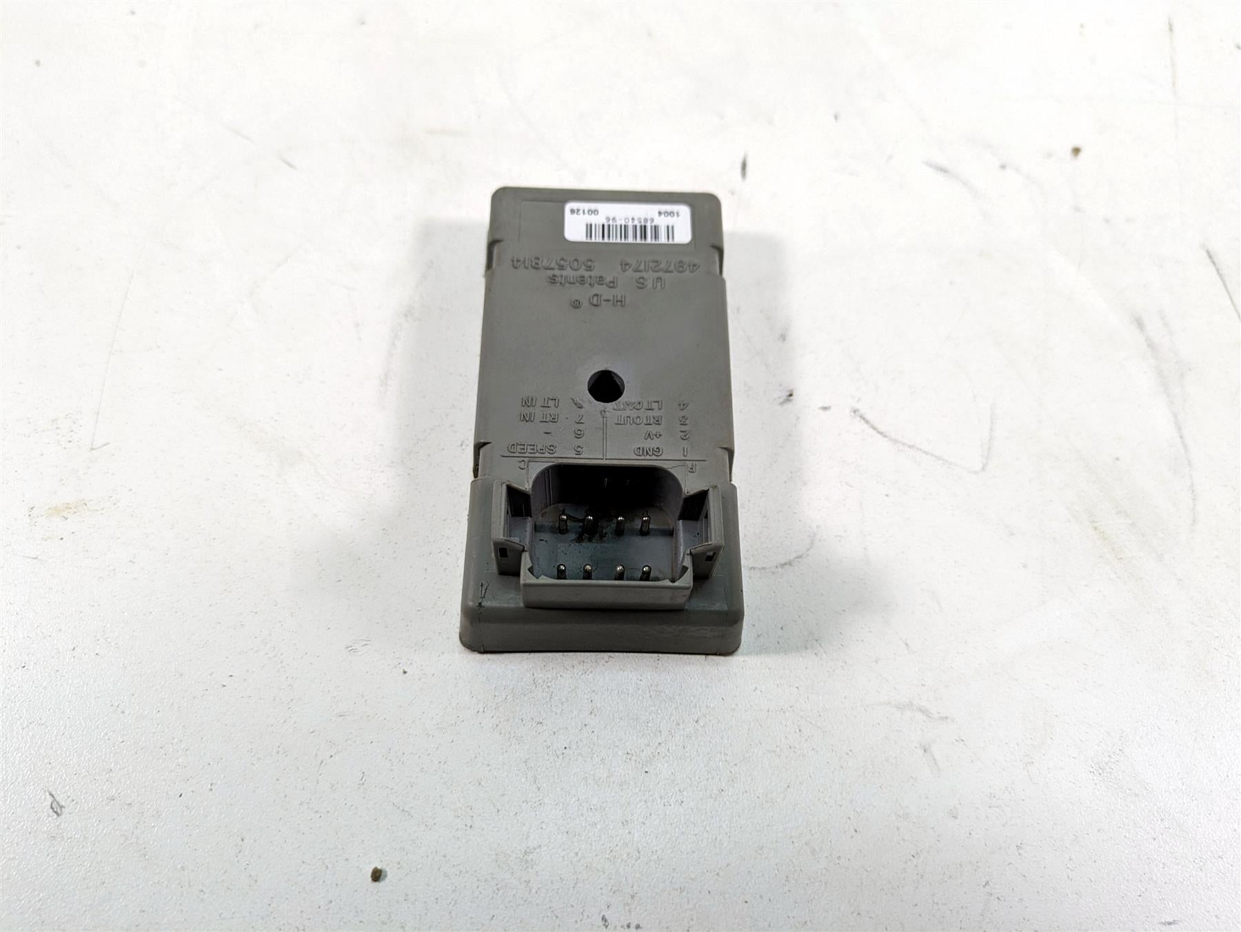 Used motorcycle electronic control module connector on white background, available at Mototech271