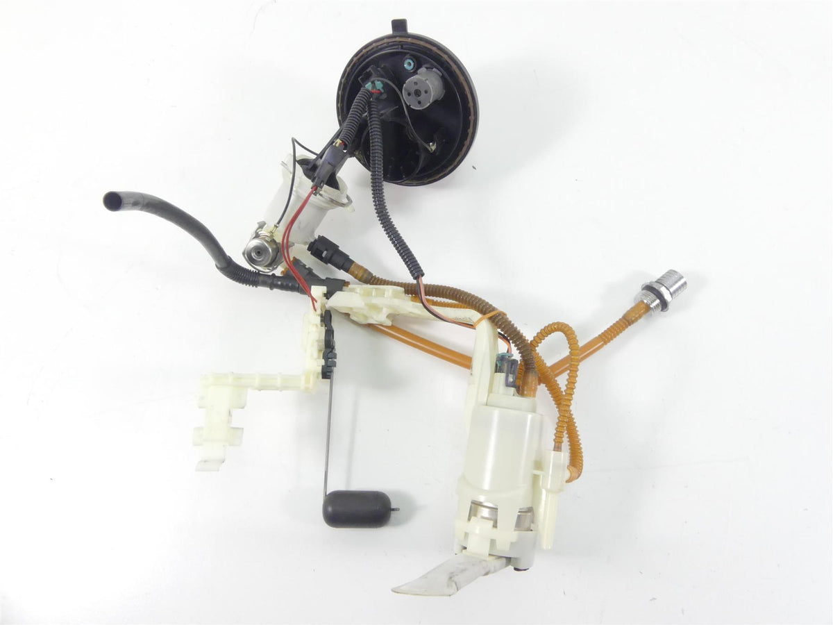 Used motorcycle fuel pump assembly with wiring and sensor on white background, available at Mototech271