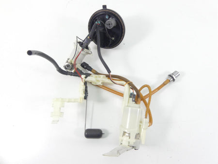 Used motorcycle fuel pump assembly with wiring and sensor on white background, available at Mototech271