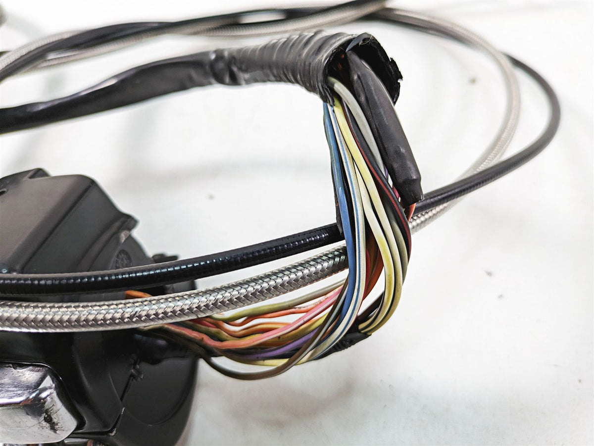 Close-up of used motorcycle handlebar wiring harness with exposed colored wires, available at Mototech271