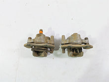 Load image into Gallery viewer, 2011 Can-Am Outlander 650 4X4 XT Front Brake Caliper Set 705600576 705600575
