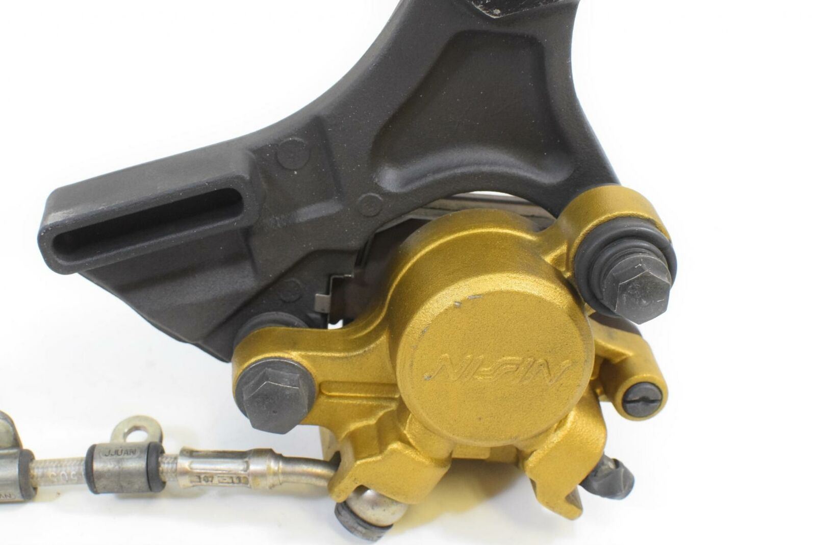 2012 Triumph Street Triple 675 R Nissin Rear Brake Caliper With Line T2307352 {{ shop.shopifyCountryName }} - Mototech271