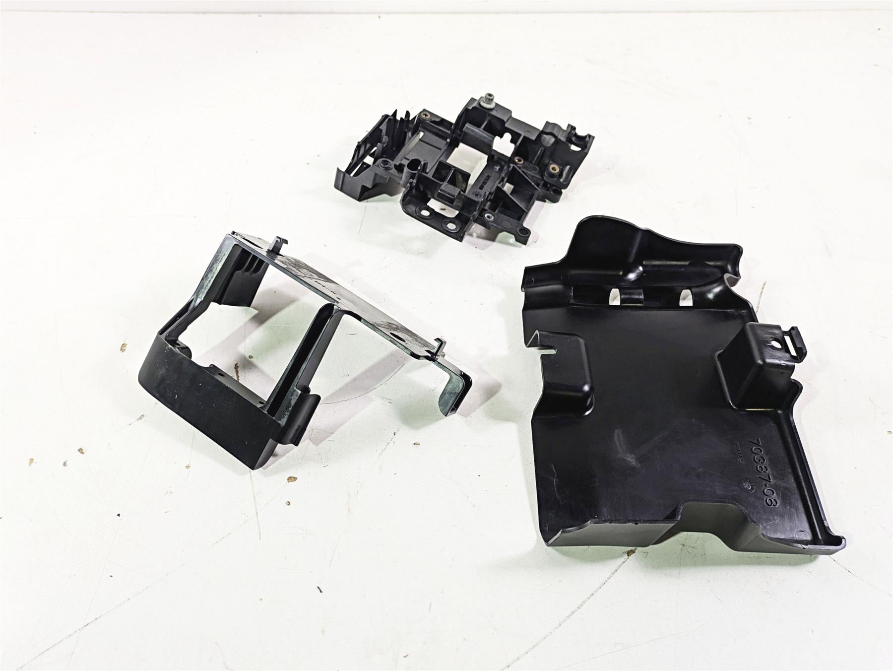 2009 Harley FXCWC Softail Rocker Electrical Carrier Holder Stay Set 70387-08 {{ shop.shopifyCountryName }} - Mototech271