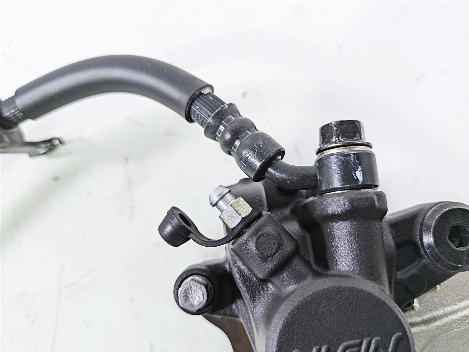 2008 Honda CBR1000RR SC59 Nissin Rear Brake Caliper + Line 43150-MEL-D31 {{ shop.shopifyCountryName }} - Mototech271