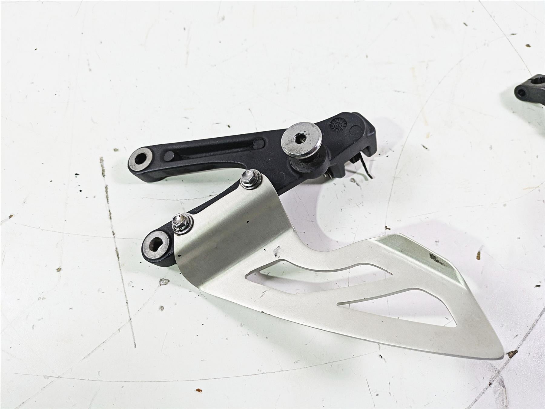 2012 Triumph Daytona 675 Left Rider Footpeg Mount + Shifter Parts T2082066 {{ shop.shopifyCountryName }} - Mototech271
