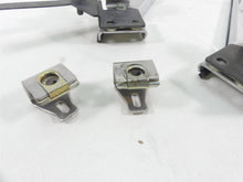 Load image into Gallery viewer, 2004 Harley FLHTC SE CVO Electra Glide Saddlebag Guard Rail Set 90718-79 | Mototech271
