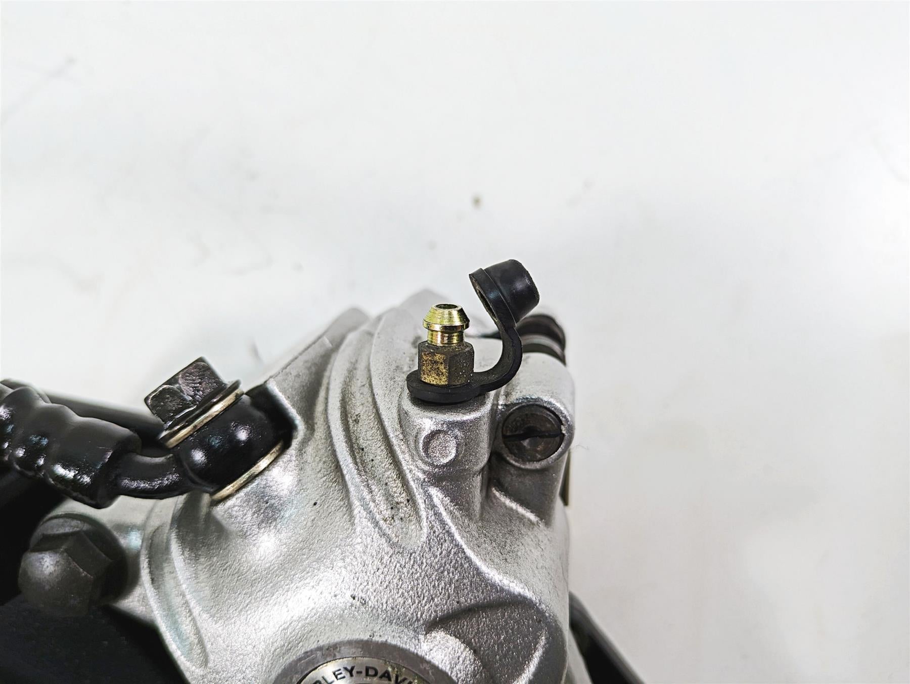 2006 Harley Sportster XL1200 Rear Brake Caliper + Bracket & Line 40968-05A {{ shop.shopifyCountryName }} - Mototech271