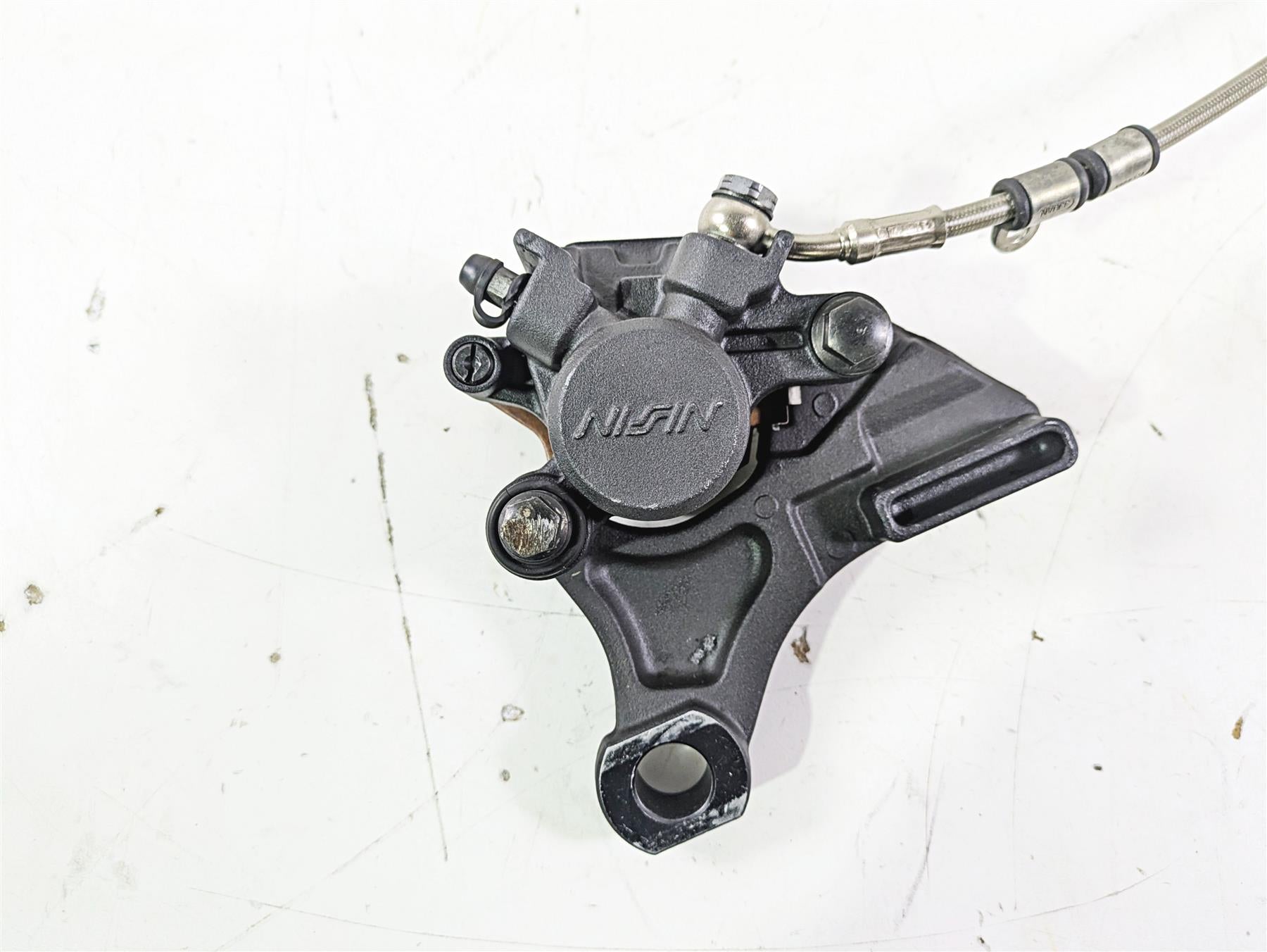 2012 Triumph Daytona 675 Nissin Rear Caliper + Line & Bracket T2021410 {{ shop.shopifyCountryName }} - Mototech271