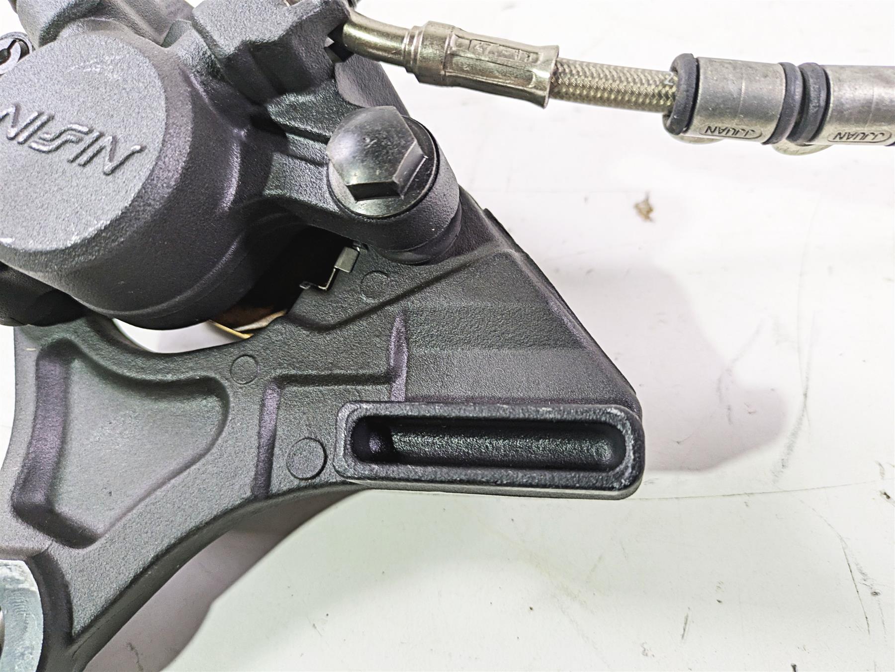 2012 Triumph Daytona 675 Nissin Rear Caliper + Line & Bracket T2021410 {{ shop.shopifyCountryName }} - Mototech271