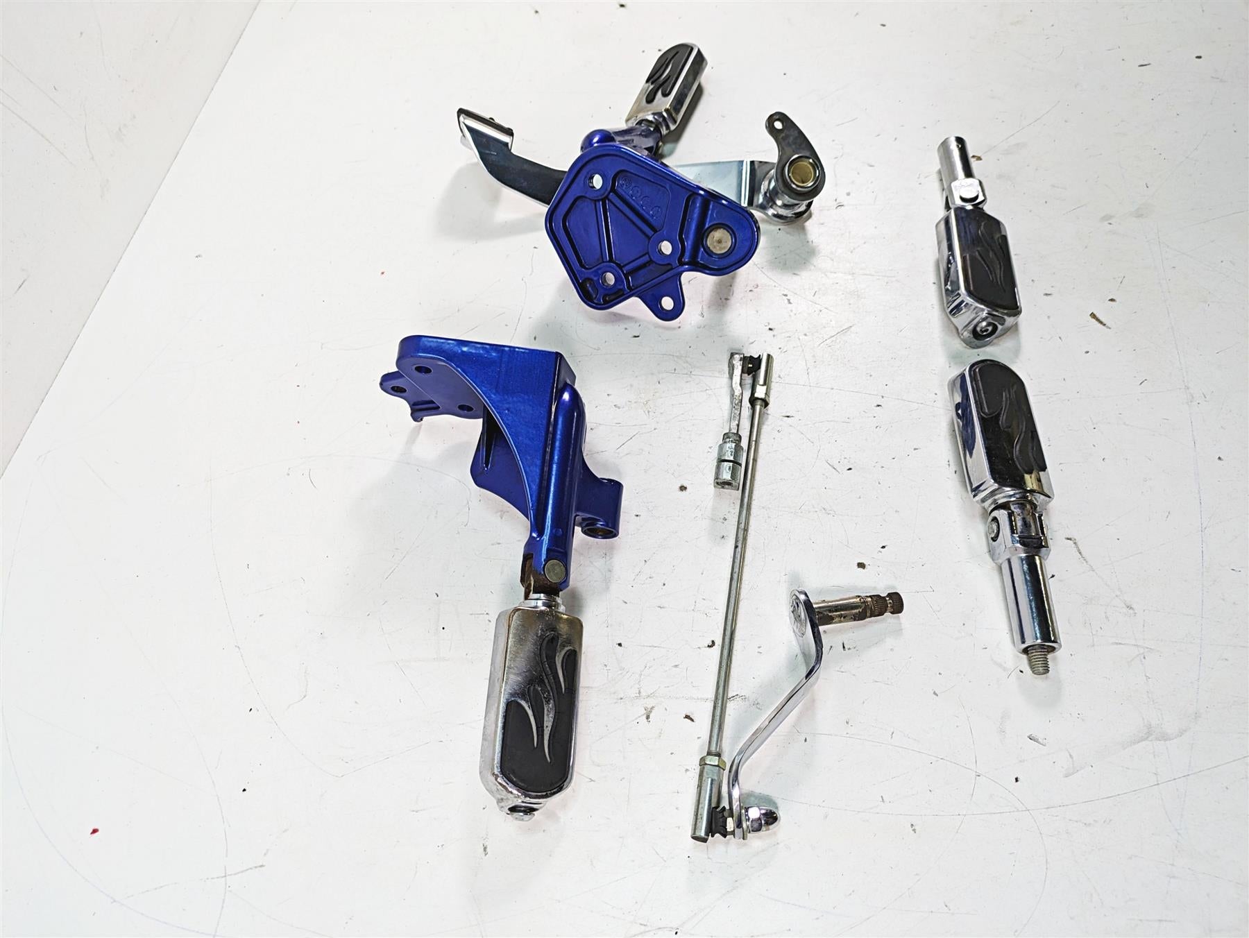 2009 Harley FXCWC Softail Rocker C Flame Foot Peg & Blue Brackets Set 33683-07A {{ shop.shopifyCountryName }} - Mototech271