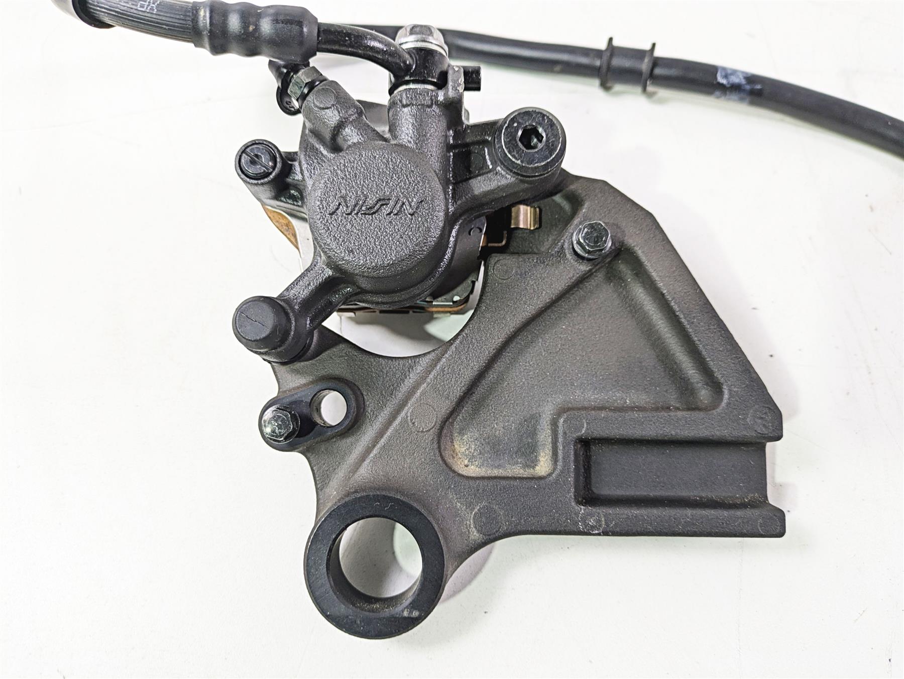 2024 Kawasaki ZX6R ZX636 Ninja Nissin Rear Brake Caliper + Mount 43080-0242-DJ {{ shop.shopifyCountryName }} - Mototech271