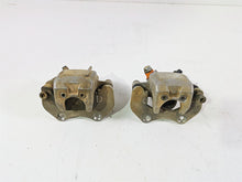 Load image into Gallery viewer, 2011 Can-Am Outlander 650 4X4 XT Front Brake Caliper Set 705600576 705600575
