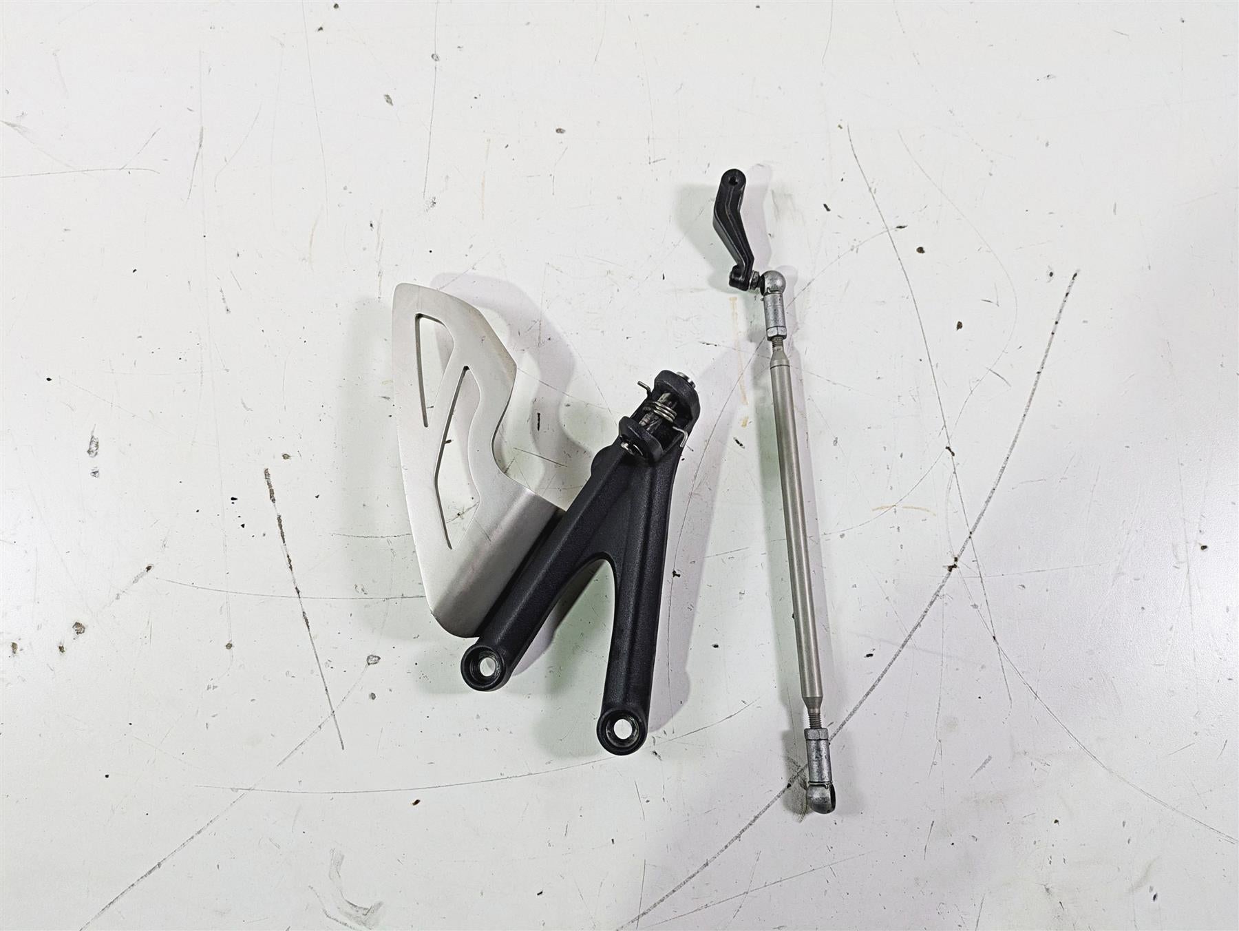 2012 Triumph Daytona 675 Left Rider Footpeg Mount + Shifter Parts T2082066 {{ shop.shopifyCountryName }} - Mototech271