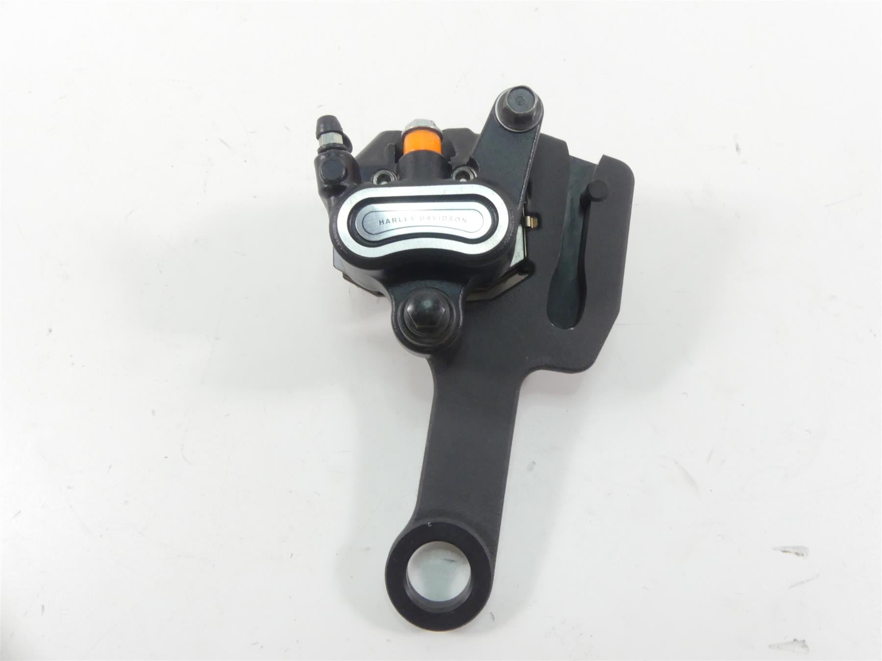 2019 Harley FLHC Softail Heritage Rear Brake Caliper & Bracket Mount 41300192