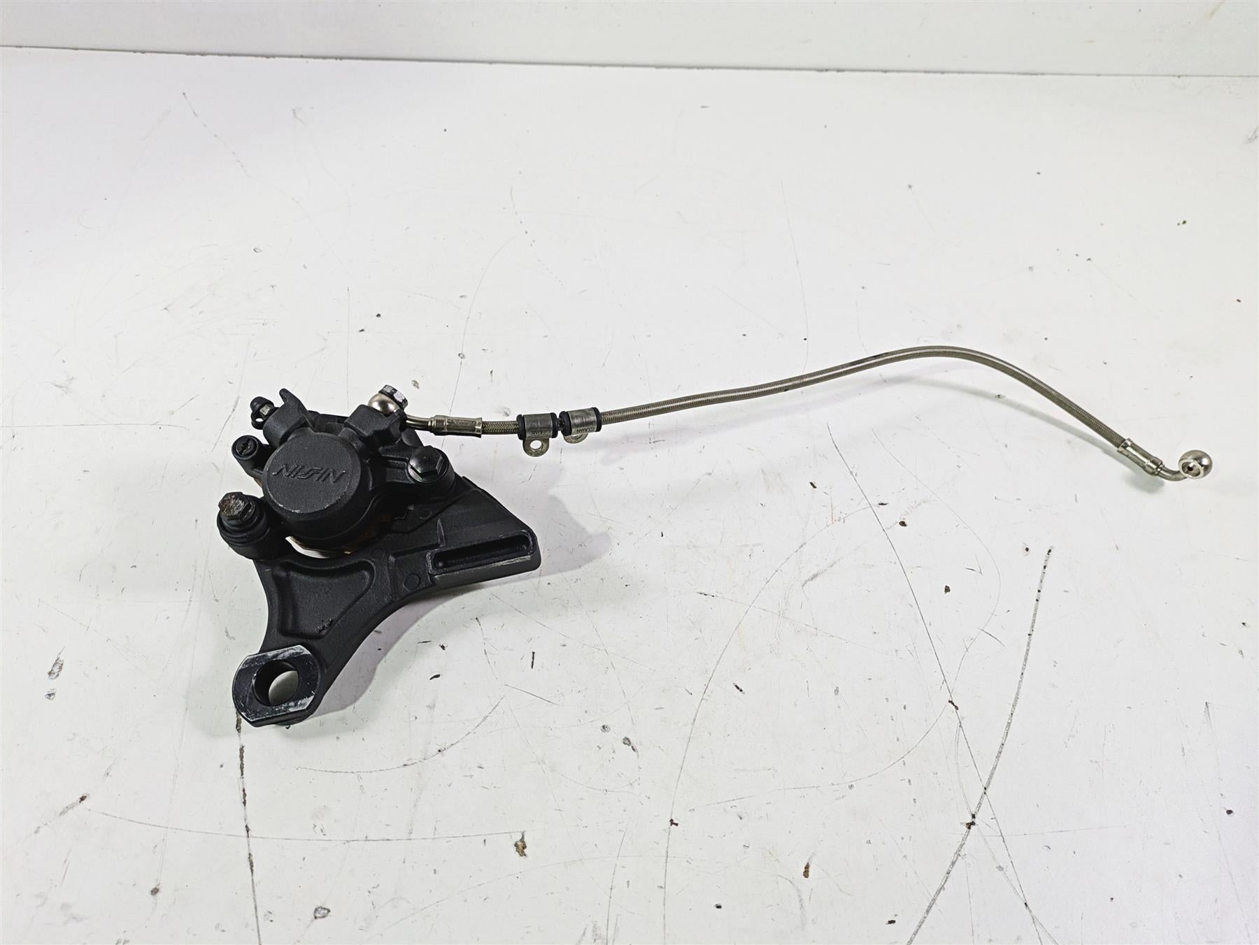 2012 Triumph Daytona 675 Nissin Rear Caliper + Line & Bracket T2021410 {{ shop.shopifyCountryName }} - Mototech271