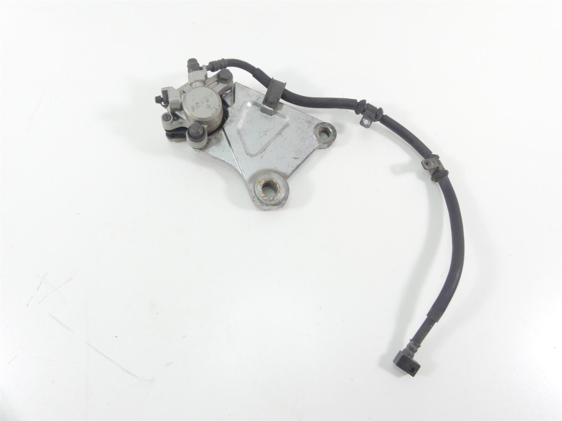 2003 Honda VTX1300 S Rear Nissin Brake Caliper + Bracket & Line 43150-MEA-671 {{ shop.shopifyCountryName }} - Mototech271