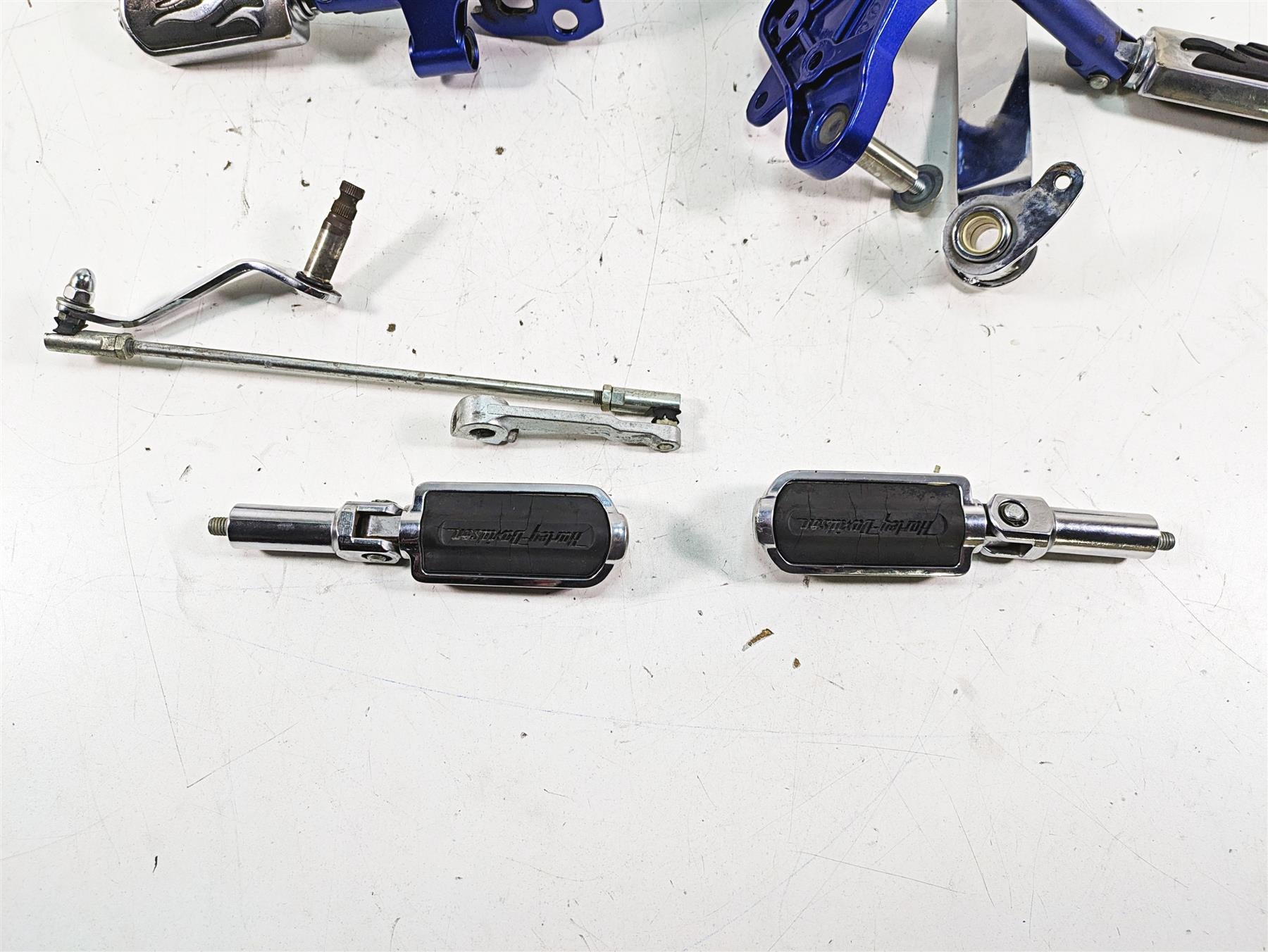 2009 Harley FXCWC Softail Rocker C Flame Foot Peg & Blue Brackets Set 33683-07A {{ shop.shopifyCountryName }} - Mototech271