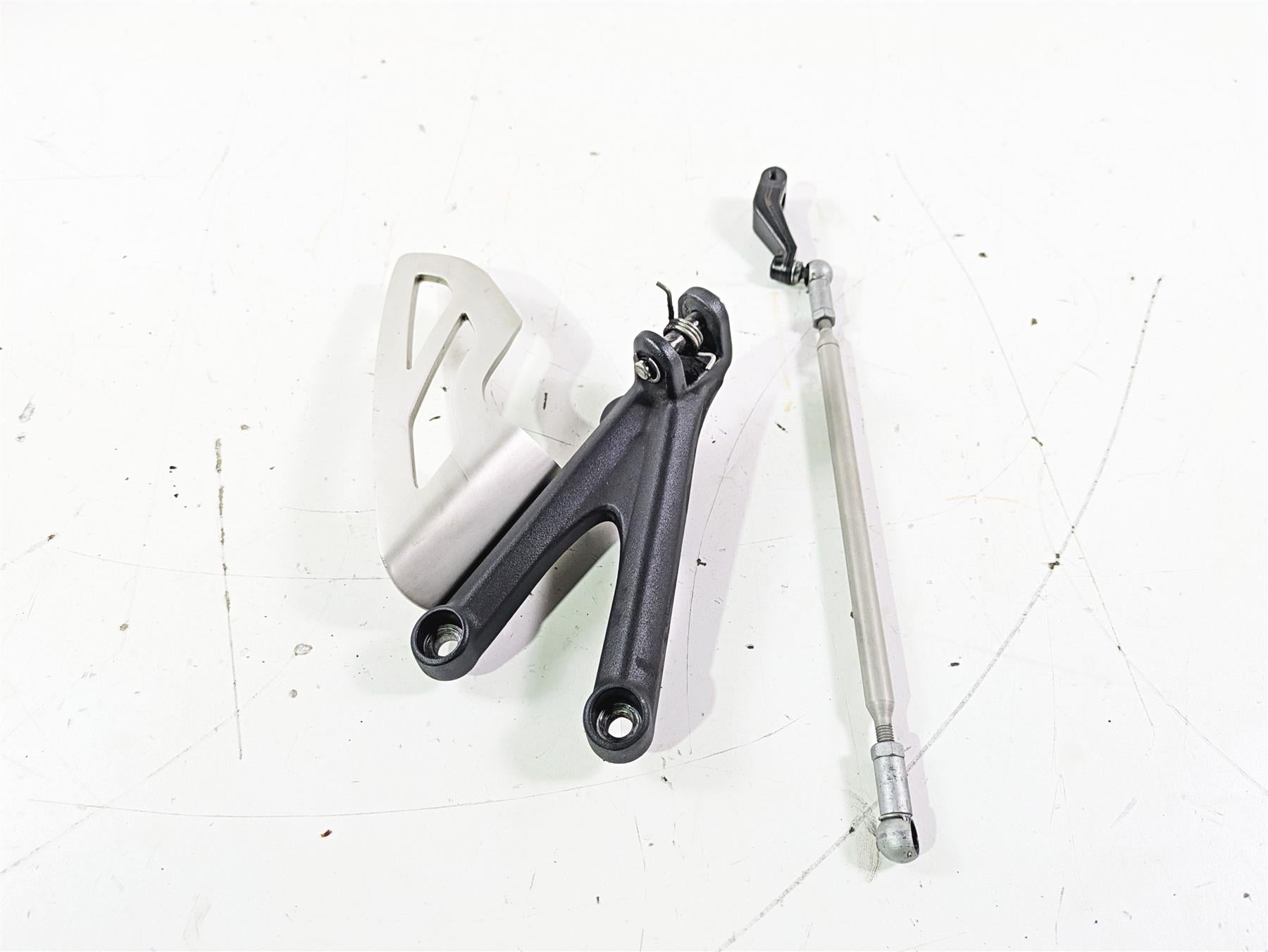 2012 Triumph Daytona 675 Left Rider Footpeg Mount + Shifter Parts T2082066 {{ shop.shopifyCountryName }} - Mototech271