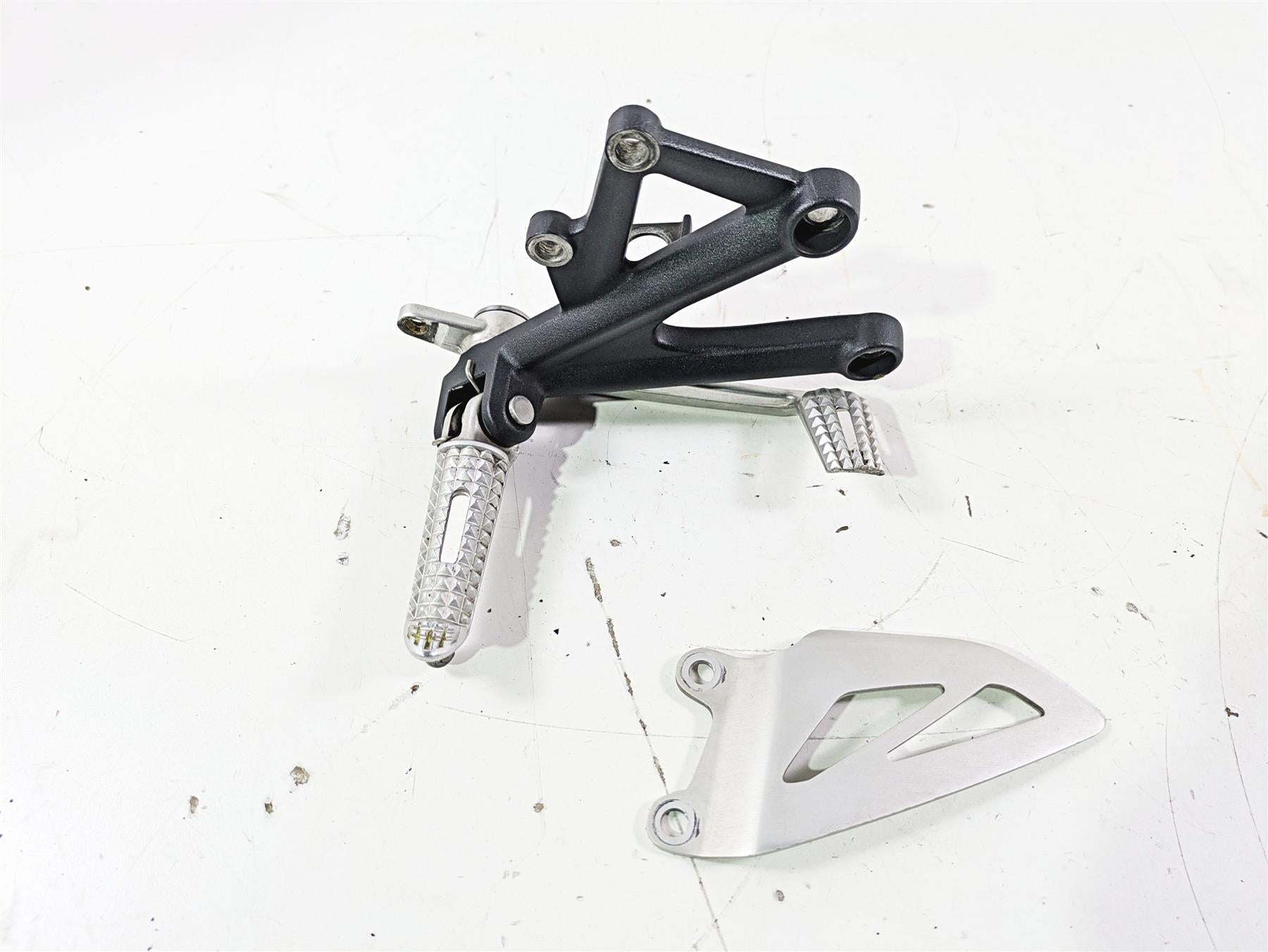 2012 Triumph Daytona 675 Right Rider Footpeg & Brake Pedal Set T2082056 T2082056 {{ shop.shopifyCountryName }} - Mototech271